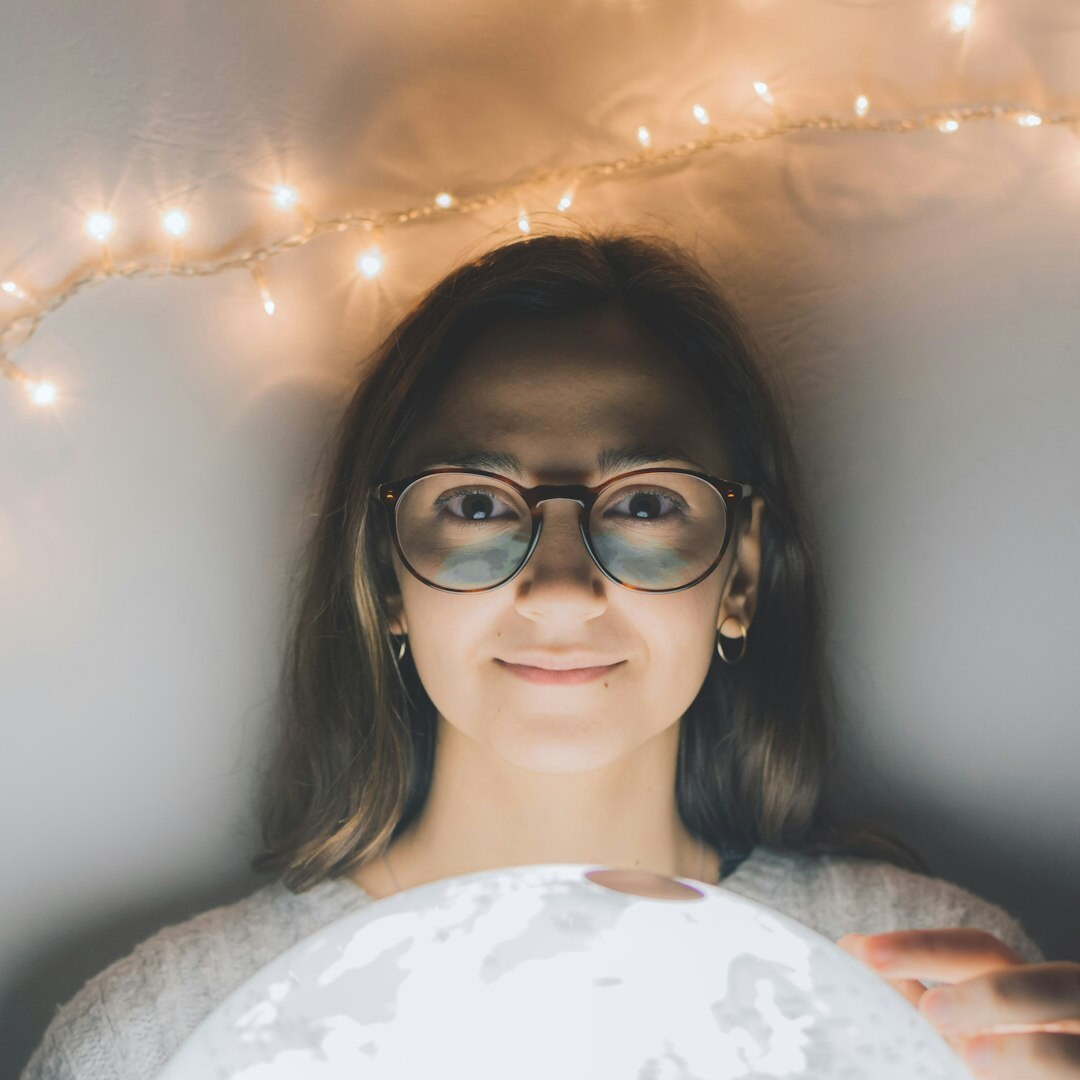 Young professional woman with glasses smiling